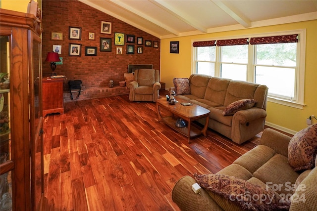 living room featuring hardwood / wood-style flooring, lofted ceiling with beams, and brick wall