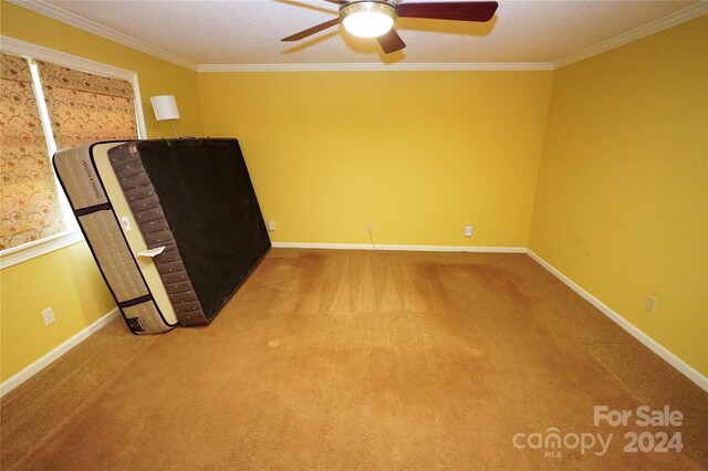 interior space featuring ornamental molding and ceiling fan