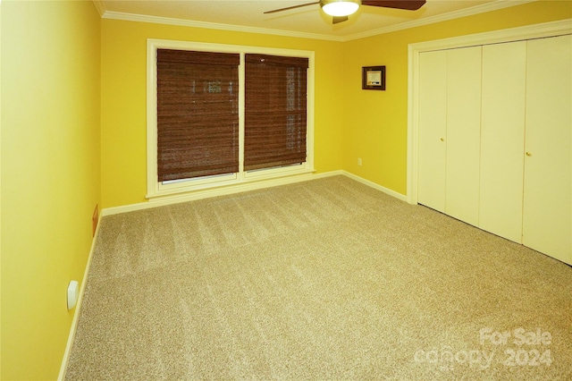 unfurnished bedroom with ceiling fan, a closet, and light colored carpet