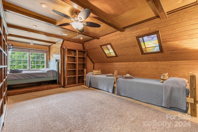 unfurnished bedroom featuring ceiling fan, wood ceiling, wood walls, and carpet flooring