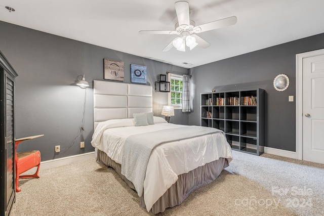 carpeted bedroom with ceiling fan