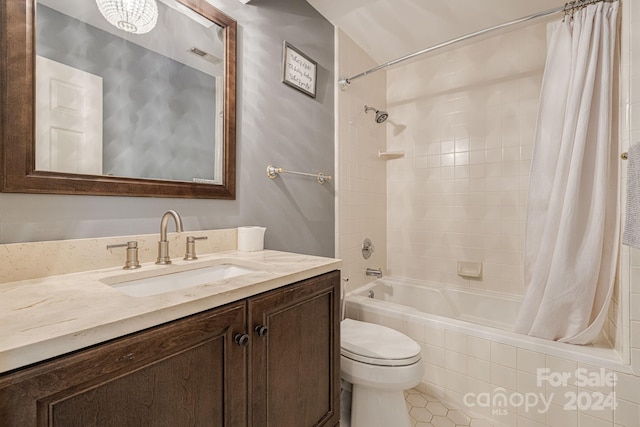 full bathroom with toilet, vanity, tile patterned flooring, and shower / tub combo with curtain