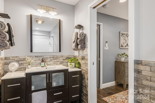 bathroom featuring curtained shower and vanity