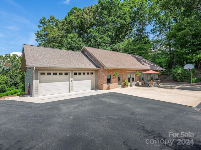 single story home with a garage