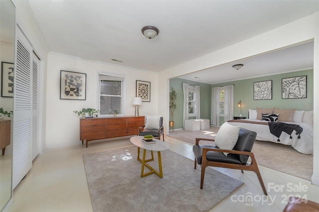 bedroom with a closet and ornamental molding