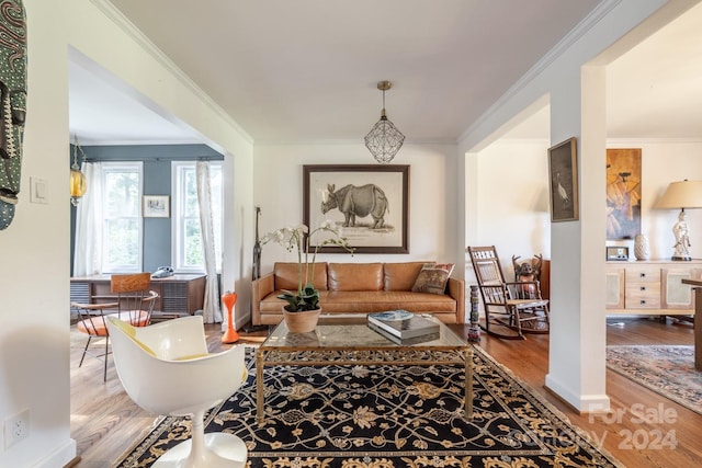 living room featuring ornamental molding and hardwood / wood-style flooring