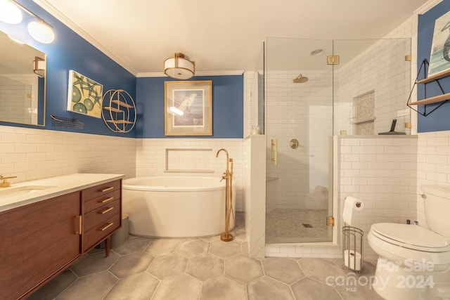 full bathroom featuring toilet, vanity, tile walls, and separate shower and tub