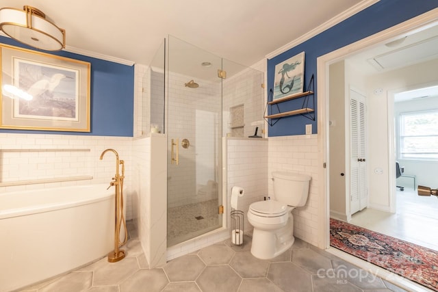 bathroom with independent shower and bath, toilet, tile patterned floors, tile walls, and ornamental molding