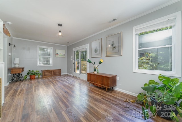 unfurnished room featuring dark wood-type flooring and crown molding