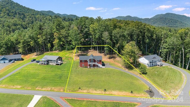 aerial view featuring a mountain view and a wooded view