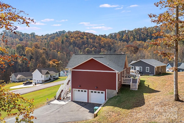 exterior space featuring a forest view