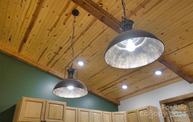 interior details featuring beamed ceiling, hanging light fixtures, and light brown cabinetry