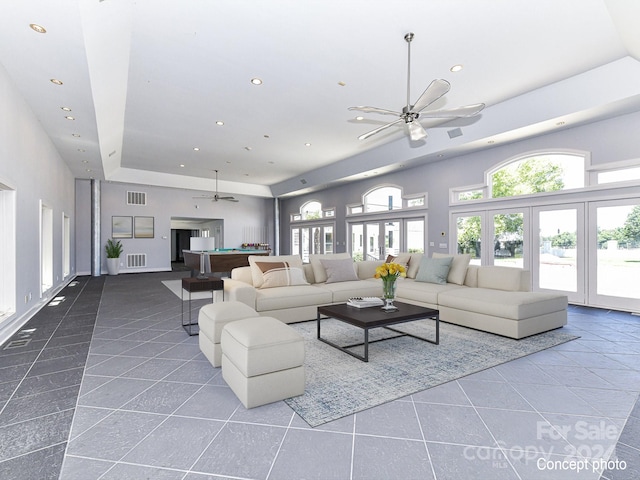 living room featuring ceiling fan, billiards, tile patterned flooring, and a high ceiling