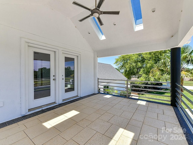 view of patio with ceiling fan and a balcony