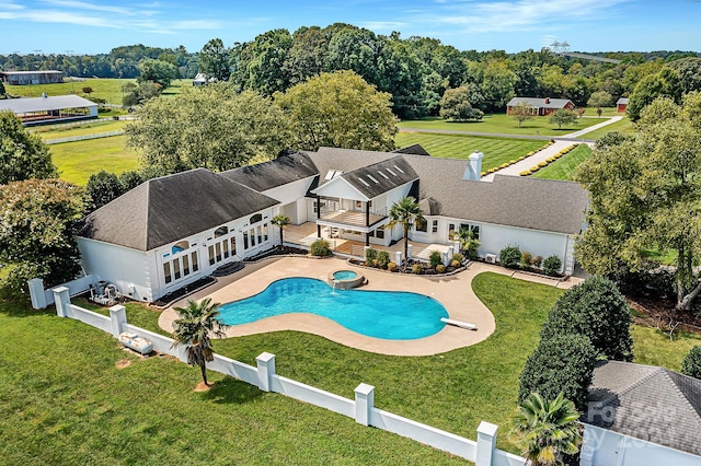 view of swimming pool featuring a yard, french doors, and a patio