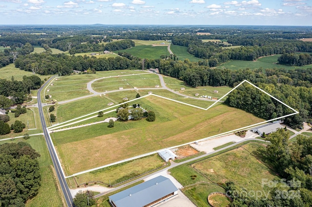 birds eye view of property featuring a rural view