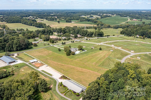 birds eye view of property featuring a rural view