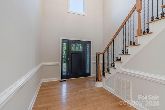 foyer entrance with light hardwood / wood-style flooring