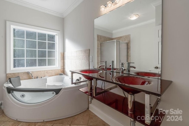 bathroom featuring tile patterned floors, double sink, shower with separate bathtub, and ornamental molding