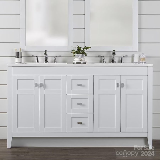 bathroom with hardwood / wood-style floors and vanity