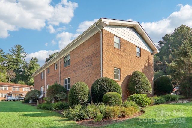 view of home's exterior featuring a yard