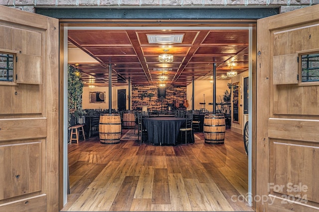 interior space featuring wooden ceiling and hardwood / wood-style floors