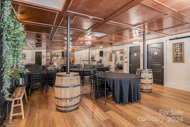 dining room with wooden ceiling, wood-type flooring, and coffered ceiling