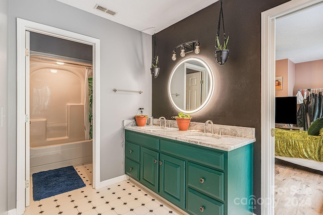 bathroom with shower / tub combination and vanity