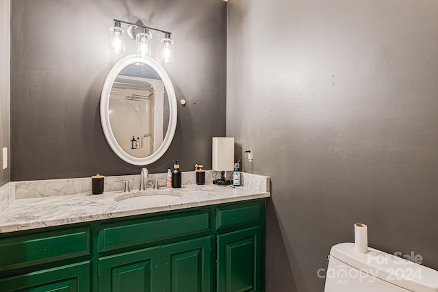 bathroom featuring toilet and vanity