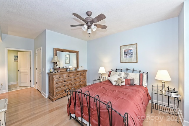 bedroom with ceiling fan and light hardwood / wood-style flooring