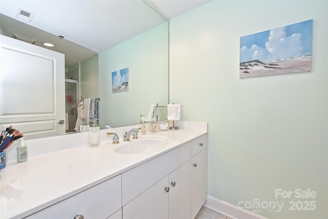 bathroom featuring tile patterned floors and vanity