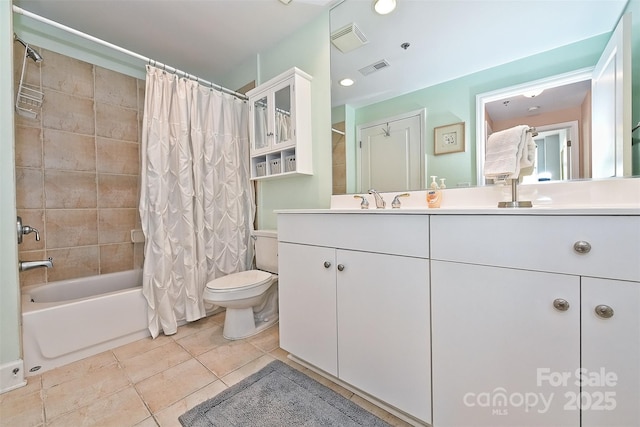 full bathroom featuring tile patterned floors, vanity, shower / tub combo, and toilet