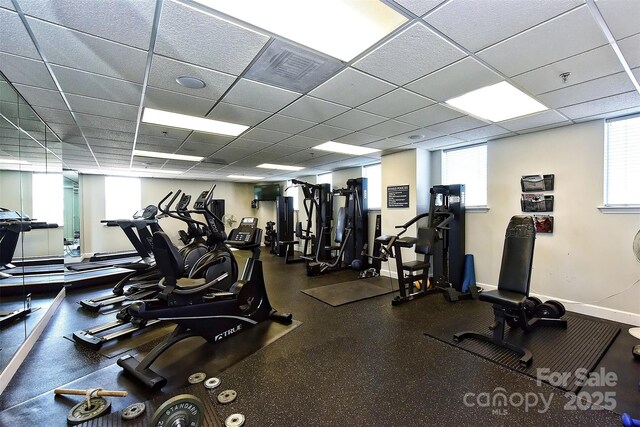 exercise room featuring a drop ceiling