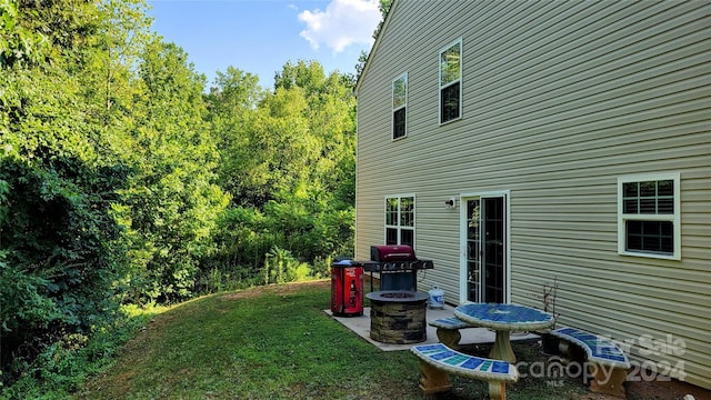 view of yard with a patio area and a fire pit