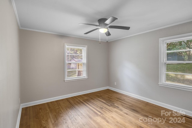 unfurnished room with ceiling fan, ornamental molding, and light hardwood / wood-style floors