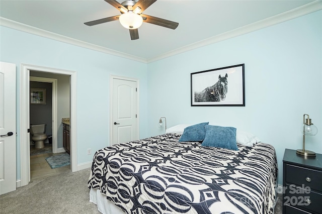 carpeted bedroom featuring crown molding, ceiling fan, and connected bathroom