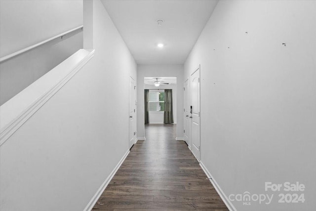 hallway with dark wood-type flooring