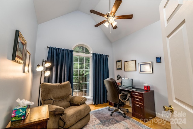 home office featuring light hardwood / wood-style flooring, ceiling fan, and high vaulted ceiling