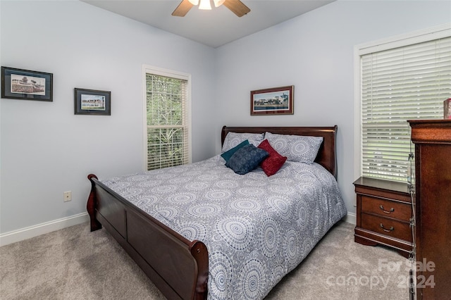 bedroom with light carpet and ceiling fan