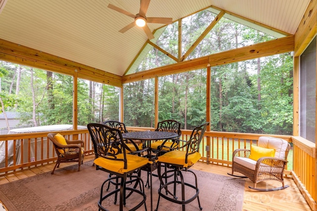 sunroom / solarium featuring ceiling fan and vaulted ceiling