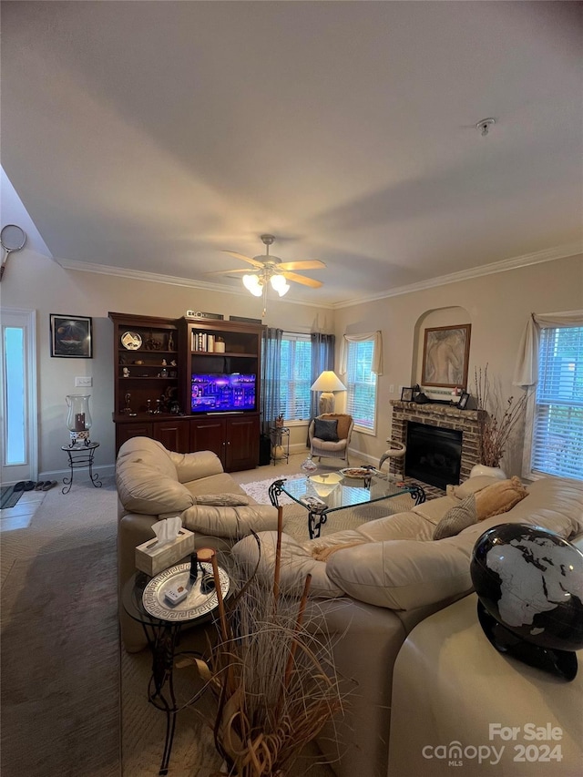 carpeted living room featuring crown molding and ceiling fan