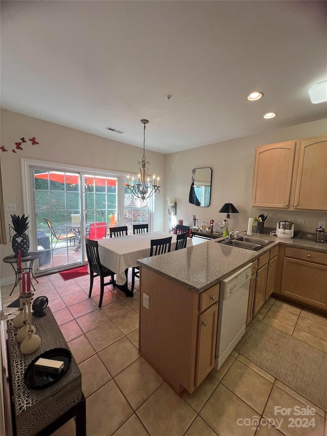 kitchen featuring pendant lighting, dishwasher, sink, a notable chandelier, and light brown cabinets