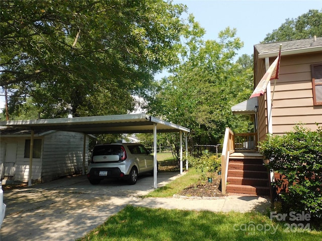 view of vehicle parking with a carport