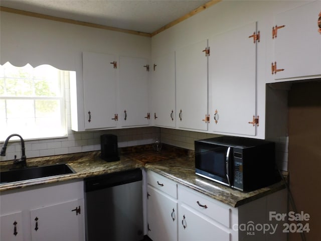 kitchen featuring sink, white cabinetry, and stainless steel dishwasher