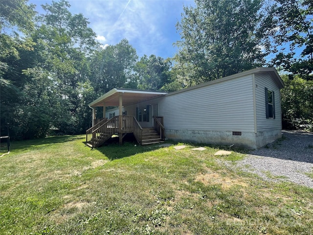 rear view of house with a lawn