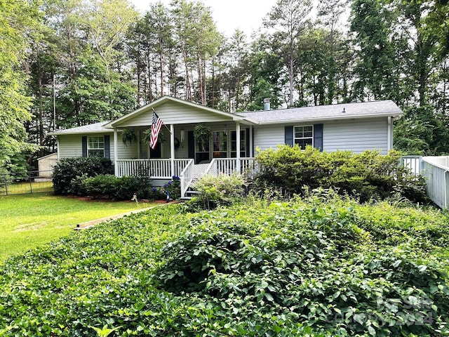 single story home featuring a front lawn and a porch