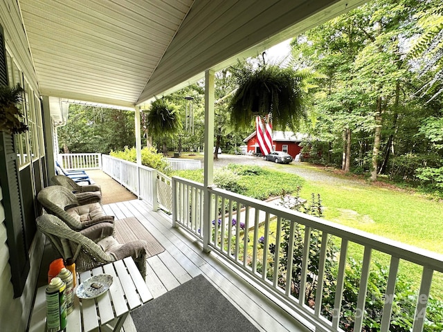 wooden terrace featuring a porch