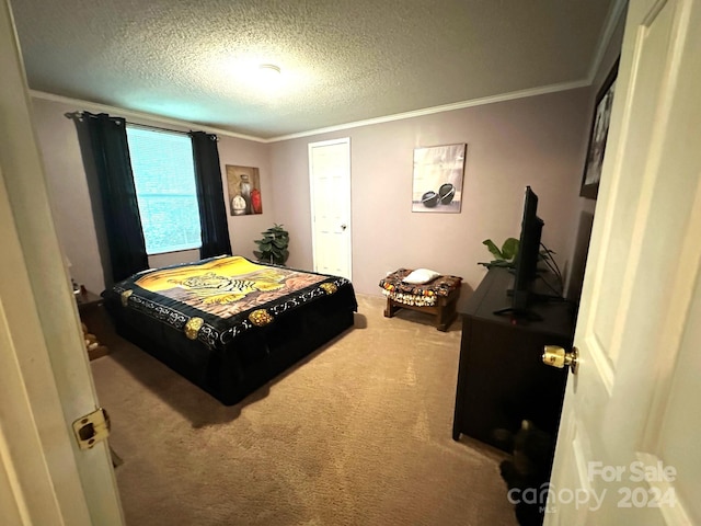 carpeted bedroom with a textured ceiling and ornamental molding