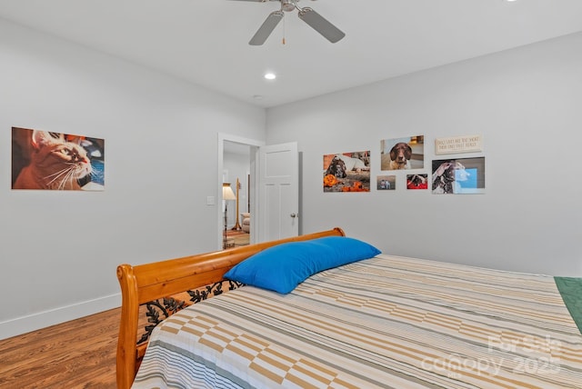bedroom with wood finished floors, ceiling fan, baseboards, and recessed lighting