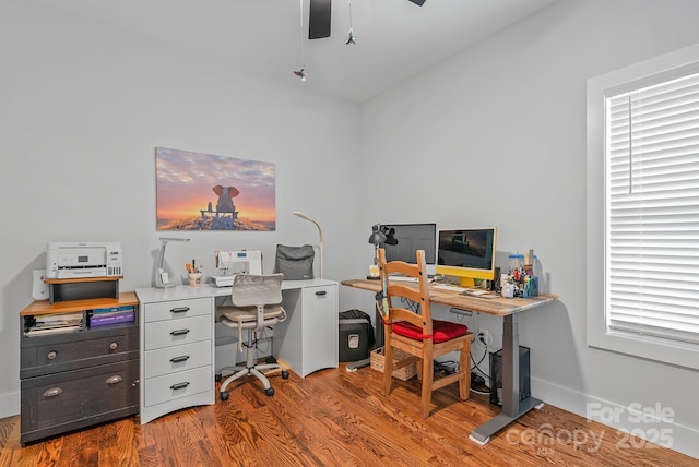 office area with wood finished floors and ceiling fan